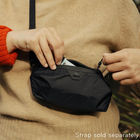 Person holding Ultralight Terra Shell Packing Cube Weatherproof Luggage Organizer With Strap Attachment Points Size S