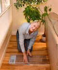Person installing Air Under Furniture Magnetic Vent Extender For 10 To 12 Inch Floor Registers Extends From 17 To 33 Inches