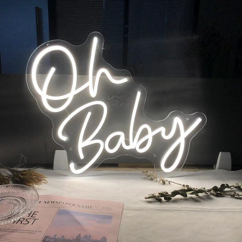 Custom Neon Sign For Any Party Oh Baby Warm White LED Neon Light for event decor, table display with flowers and magazines.