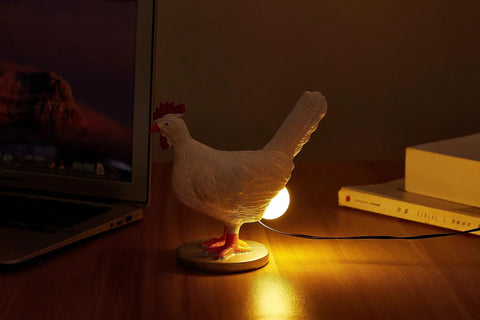 Lit 3D Lifelike Chicken Egg Lamp Night Light on desk, resin egg table lamp with USB, glowing LED light for bedroom or living room.