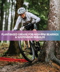 Cyclist on muddy trail riding using Plant-Based Bike Grease for Suspension and Components, Bombproof High-Performance Lube for Ceramic Bearings
