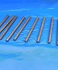 Rock Solid Taper Pins Pack Of Ten Size Five Diameter Four Inch Overall Length Heavy Steel laid out on blue background.