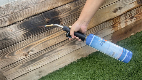 Two 1Lb Empty Propane Tanks for Torch Soldering and Welding, Refillable blue cylinder in use on wooden surface