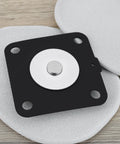 Replacement diaphragm kit for pulse valve; black square mounting plate with white diaphragm and centered metal plug.