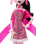Iconic Design Draculaura Reproduction Doll In A Dope Pink Ruffle Dress featuring striped pink gown and accessories, perfect for display.