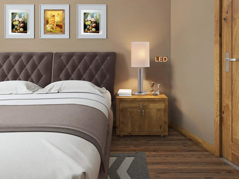 27 Inch Slim Oval LED Touch Table Lamp With 8W LED Bulbs Included Delivers 1000 Lumens in bedroom setting on nightstand