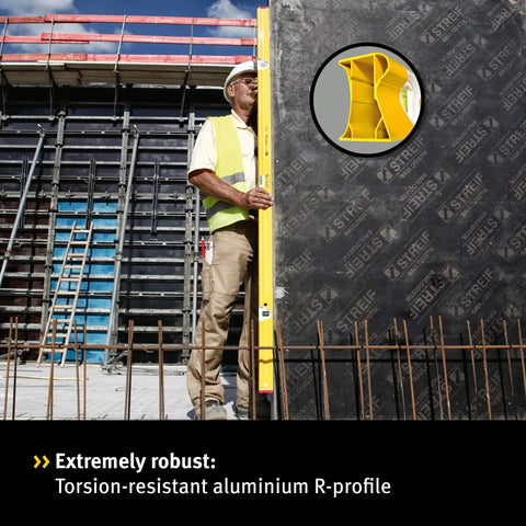 STABILA Type R 300 Spirit Level, 40 cm, used by construction worker on site with torsion-resistant aluminium R profile.