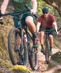Cyclists on gravel trail using Top Shelf Aluminum Drop Bar With 50 Or 70mm Rise And 44cm Width For Road, Gravel, Touring, And Commuter Bikes Ultra Comfy Upright Position Easy Reach To Drops Flare Backsweep.