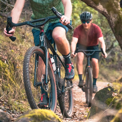 Cyclists riding gravel bikes with Top Shelf Aluminum Drop Bar With 50mm Rise And 44cm Width for road, gravel, touring and commuter bikes.