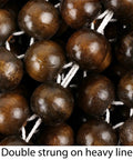 Close-up of double strung wood beads on heavy line from Natural Wood Beaded Seat Cover With Massaging Cooling Ventilated Cushion For Car And Truck Keeps Your Back From Sweating And Makes Long Drives Way More Comfortable Relieves Tension And Pain Double Strung Beads For Sturdy Support.