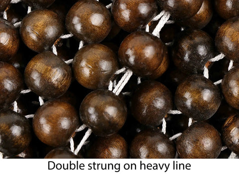 Close-up of double strung wood beads on heavy line from Natural Wood Beaded Seat Cover With Massaging Cooling Ventilated Cushion For Car And Truck Keeps Your Back From Sweating And Makes Long Drives Way More Comfortable Relieves Tension And Pain Double Strung Beads For Sturdy Support.