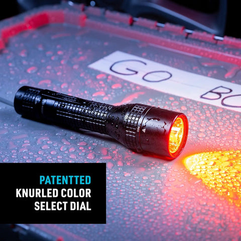 PowerSwitch Dual Color LED Flashlight With Rechargeable Battery And Dual Power Sources, emitting red light on wet surface