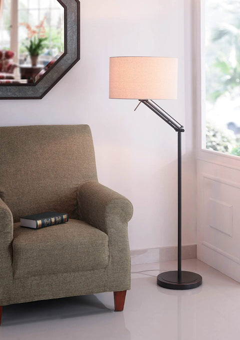 Hydra Adjustable Floor Lamp In Oil Rubbed Bronze Finish With Flexible Arm And Dual Swivel Points 63 Inch Maximum Height 28 Inch Width Casual Modern Style Perfect For Task Lighting Or Ambient Illumination In Living Room Or Office next to a grey armchair