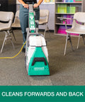 Front view of BigGreen Commercial BG10 Deep Cleaning Two Motor Carpet Extractor Machine With Dual Large Water Tanks in use in an office.