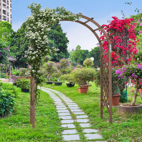7Ft Wooden Garden Arch Wedding Backdrop Stand For Ceremony, adorned with flowers, set in a lush garden path