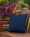 Outdoor Toss Pillows Set Of 2 16 By 16 Inches All Weather Rain Proof Fade Resistant Sapphire Blue Cushions on a bench