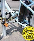 Beefed Up Heavy Duty 12mm Hardened Manganese Steel Bike Chain Lock With Six Sided Links And Nylon Cover securing an e-bike