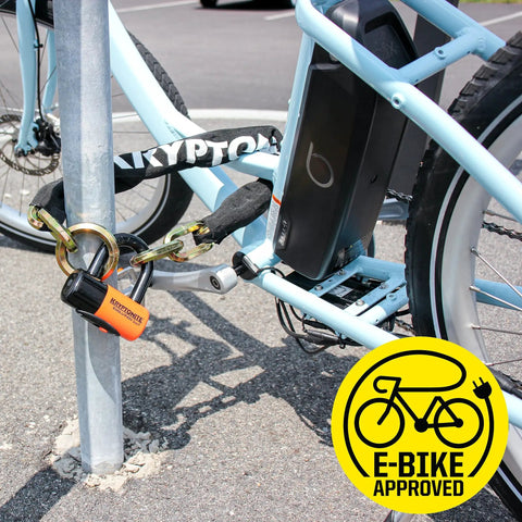 Beefed Up Heavy Duty 12mm Hardened Manganese Steel Bike Chain Lock With Six Sided Links And Nylon Cover securing an e-bike