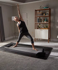 Person practicing yoga on 4x8 Gym Flooring Mat For Peloton Bike Elliptical Treadmill And Home Gym Setup Non Slip Floor Pad