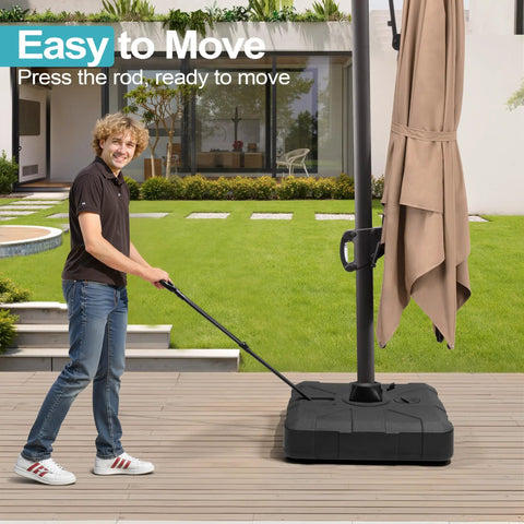 Person moving outdoor cantilever umbrella base with wheels, beefy 350 lb weighted stand for water or sand filling, patio use