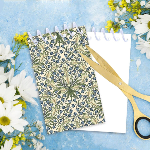 Mini Pocket Spiral Notebooks Bundle - 24 Count, 2.36 x 3.94 Inches, William Morris floral cover, on a blue background with flowers.