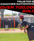 Baseball player pitching to 7 Ft X 7 Ft Baseball And Softball Practice Net With Bow Frame Carry Bag And Strike Zone in park.