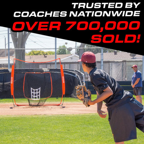 Baseball player pitching to 7 Ft X 7 Ft Baseball And Softball Practice Net With Bow Frame Carry Bag And Strike Zone in park.