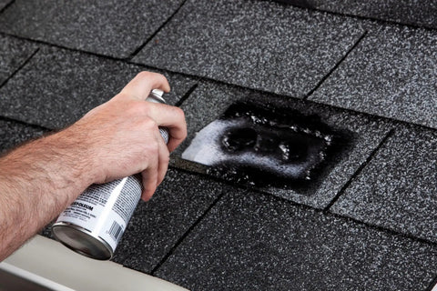 Applying Triple Thick Roof Patch And Sealer Spray 13 Oz Black on shingles for quick heavy duty roof repairs