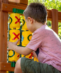 Child playing with Tic Tac Toe Spinner Activity Panel For Swing Sets, Backyard Play Accessory, Durable UV Protected Plastic, Yellow