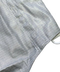Close-up of Pro Grade Lame Fencing Vest For Foil And Saber Practice And Competition, showing metallic fabric texture and edge detail.