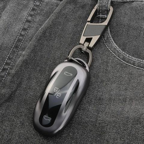 Tesla Key Fob Cover With Keychain Grippy TPU Case For Model 3 Model Y Model S, shown clipped to jeans pocket, highlighting its slim fit.