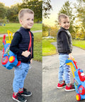 Toddler with upgraded kids golf cart with shoulder strap and putting mat in park, part of toddler golf set with putting mat for 2 3 4 year olds.