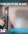 Hand using Pro Series Plaster Finishing Trowel Workhorse 4.75 Inch By 14 Inch with stainless steel blade on a wall surface