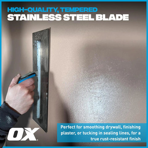 Hand using Pro Series Plaster Finishing Trowel Workhorse 4.75 Inch By 14 Inch with stainless steel blade on a wall surface
