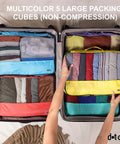 Person organizing suitcase with Large Travel Packing Cubes Set Of 5 For Suitcases Lightweight Luggage Organizer Bags With Non Compression Design