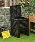 80 Gallon Garden Compost Tumbler Bin With Dual Side Loading Yellow Unit 23.75 By 23.75 By 32 Inch Size in a garden setting