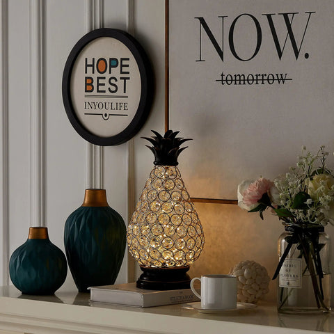 Extra Large Crystal Pineapple Lantern Lamp With IP44 Waterproof on a mantle, surrounded by decor items, battery operated.