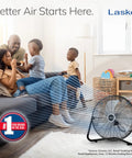 Family enjoying cool air from 20 Inch Black High Velocity Wall Mount Fan With Pivoting Head, in a living room.