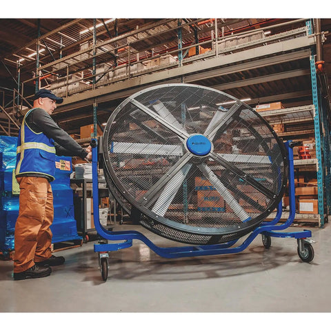 Six Foot Heavy Duty Mobile Industrial Barrel Fan Pumping Forty Thousand CFM Of Big Air Punch With Five Eighths HP ECM Motor in a warehouse.