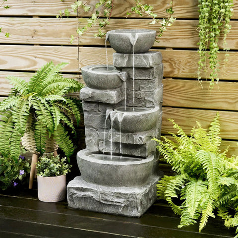 Cascading Bowls LED Outdoor Water Fountain with stacked stone base for gardens patios lawns and balconies