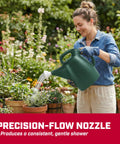 Person using 2 Gallon Watering Can For Indoor And Outdoor Plants With Removable Nozzle And Drip Free Sprinkler Head Recycled Plastic Build Easy Pour Spout For Lawn Garden And Houseplants Green