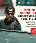 Built Tough Safety Glasses With Anti Fog Wrap Around Lenses And Scratch Beater Coating Plus Grip Lock Temples And Genuine Uv Blocking For Your Daily Grind In Black Green Tinted 10 Pack worn by a man working outdoors.