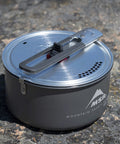 Go To Solo Camping Pot 1.3 Liter With Nonstick Ceramic Fusion Coating Lightweight Aluminum Cook Pot For Easy Solo Meals on rock surface