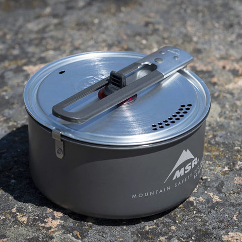 Go To Solo Camping Pot 1.3 Liter With Nonstick Ceramic Fusion Coating Lightweight Aluminum Cook Pot For Easy Solo Meals on rock surface