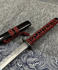 Red 3 Piece Samurai Sword Set with Display Stand close-up, featuring black and red accents on wrapped hilt and sheath for display.