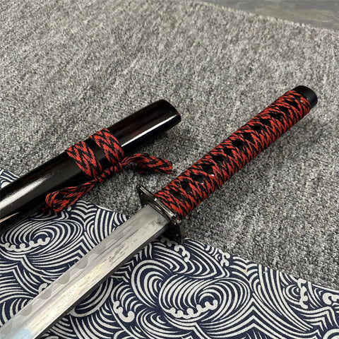 Red 3 Piece Samurai Sword Set with Display Stand close-up, featuring black and red accents on wrapped hilt and sheath for display.