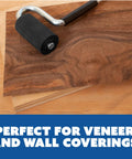 Heavy Duty Pro Grade J Roller With Thick Rubber Roller One And One Half Inch Diameter And Two And Seven Eighths Inch Wide For Veneer Laminate Wall Coverings And Edge Banding Delivers Maximum Pressure Adhesion And Smooth Flawless Finishes on wood surface
