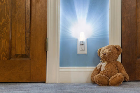 Plug In LED Night Light With Dusk To Dawn Sensor, 5000K Daylight, 5 Lumen Output, illuminating hallway with teddy bear