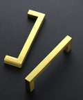 Close-up of two 25 Pack 4 Inch Gold Cabinet Pulls Brushed Brass Square Hardware For Kitchen Cabinets And Drawers 102mm Center To Center Hole Center Easy Install