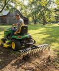 Man on tractor using Cat-0 Agricultural Field Landscape Rake With Spring Steel Tines For Quick Clearing Of Debris, Leaves, Thatch And More